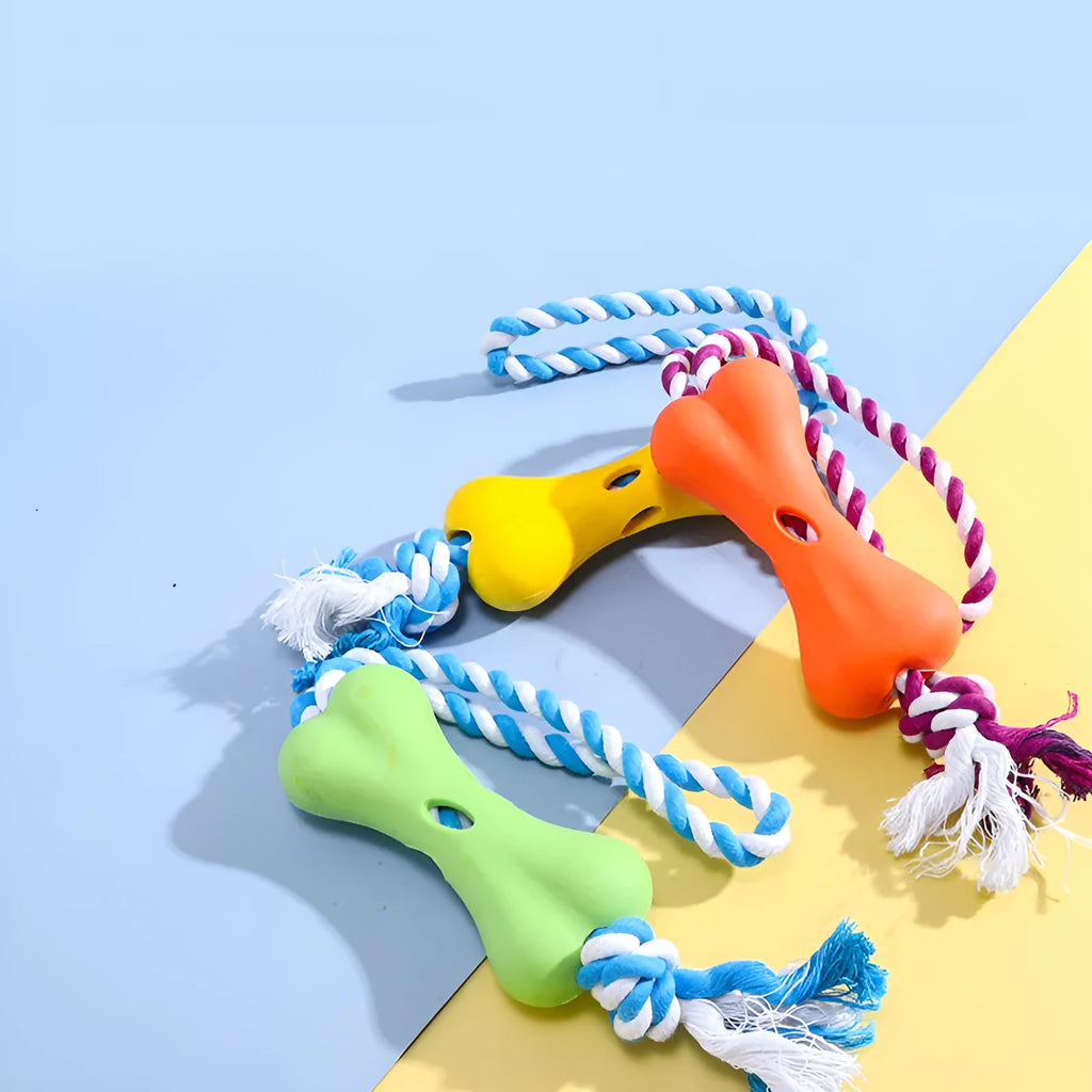 Green porous bone dog toy with rope knots for inserting treats, measuring 138x59x35mm