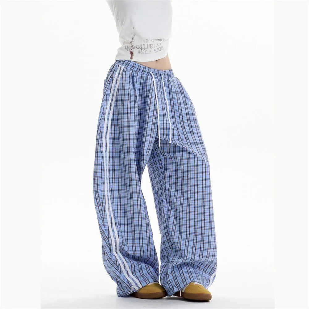Loose straight drooping wide leg polyester trousers for women with side pockets, available in blue and yellow, sizes S to XXL