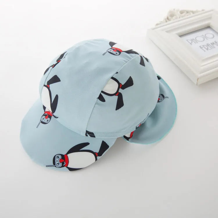 Boys' penguin print swimming costume set with long sleeves and matching swimming cap