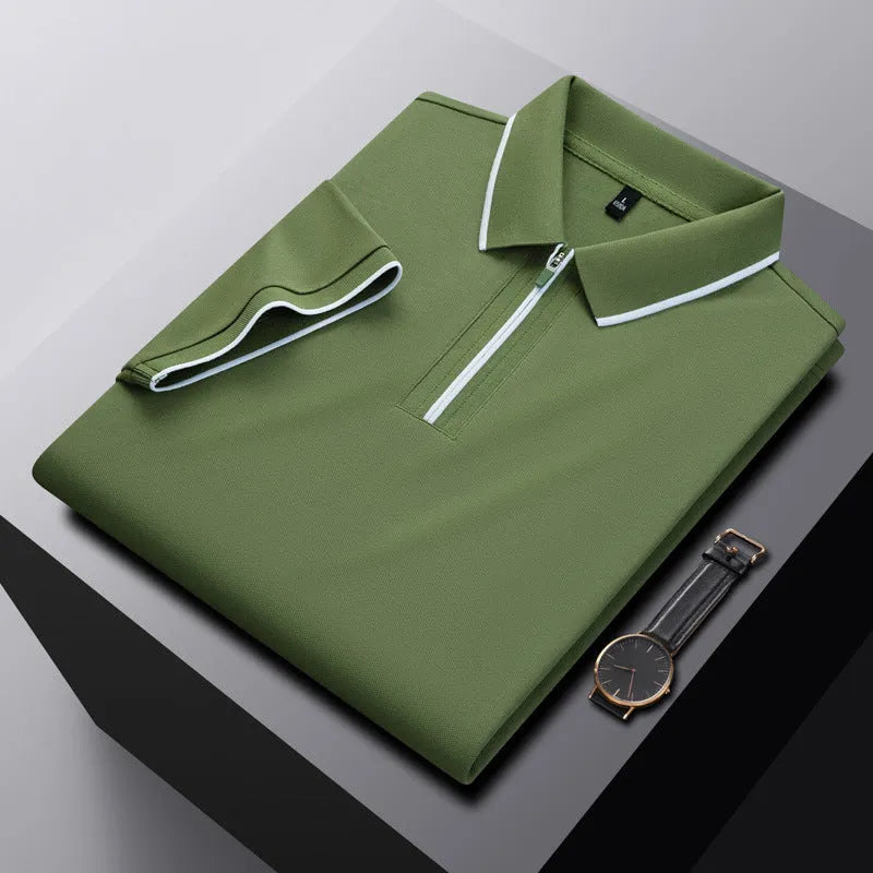 Man wearing a solid colour zip-front short-sleeve polo shirt in a casual setting.