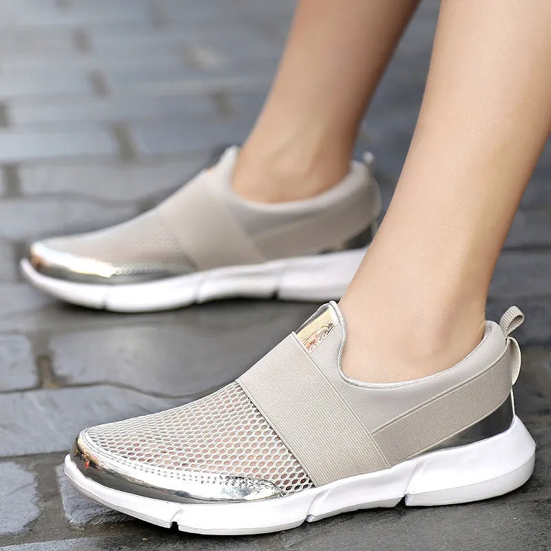 Women's breathable sneakers in black, blue, and grey with mesh lining and low tube design