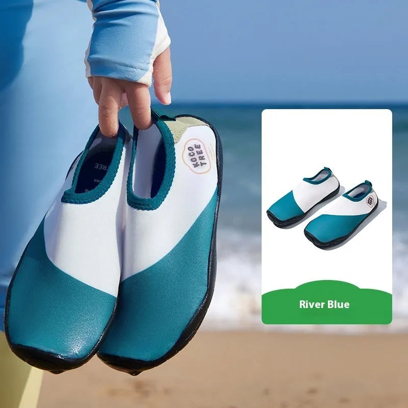 Children's anti-slip beach shoes in assorted colours with rubber soles and polyester fibre uppers.