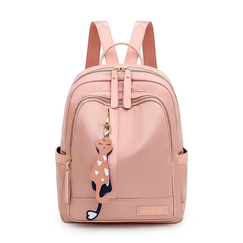 Black casual nylon backpack with shoulder straps, showing internal organiSation pockets and a soft handle.