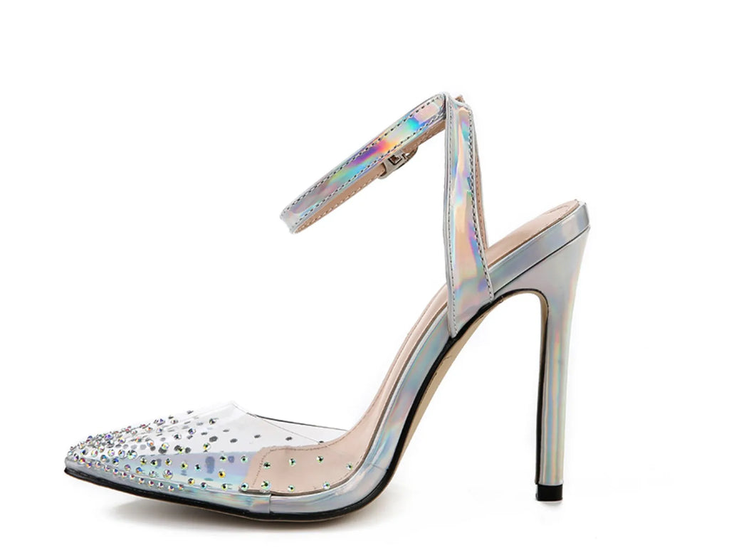 Women's pointed toe stiletto sandals with a diamond embellishment on the PVC upper and an adjustable ankle strap.