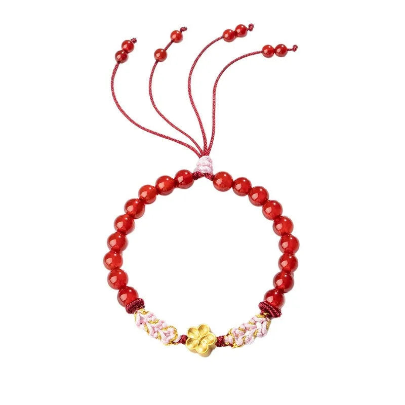Crystal bracelet with hand-woven red rope strap and peach blossom design in diamond shape