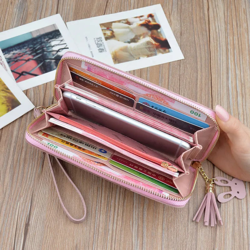 Women's long zipper tassel clutch bag with stitching detail in Black, Blue or Pink, horizontal square shape.