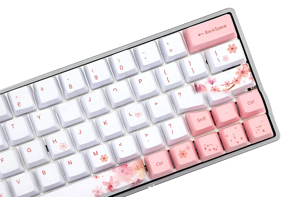 Set of pink PBT keycaps with white legends for a mechanical keyboard, shown from multiple angles.
