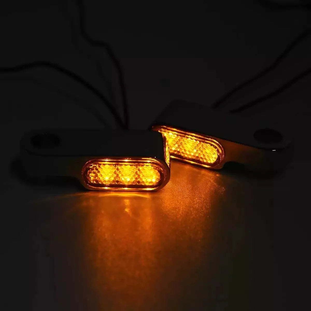 12V metal motorcycle handlebar turn signal with yellow light, shown in black or silver, single unit