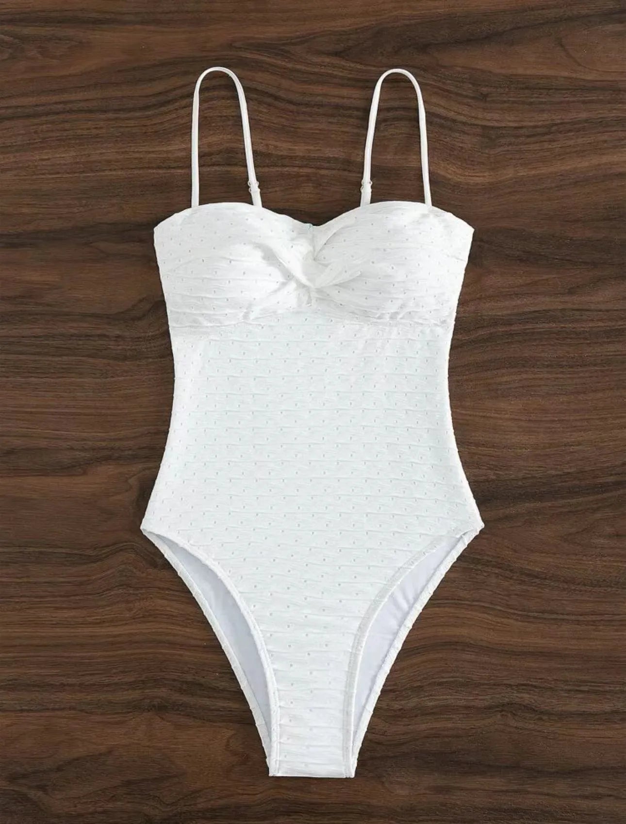 White women's one-piece swimsuit with briefs style on a mannequin