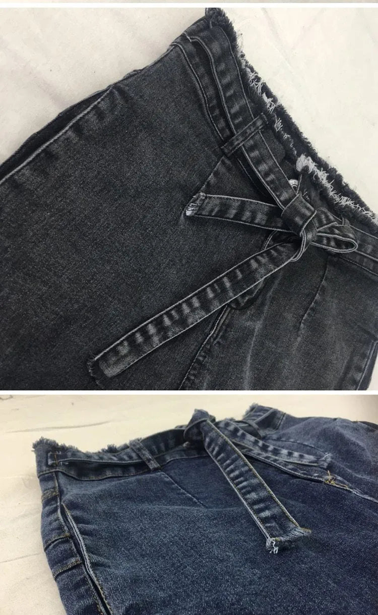 Women's fringed jeans in light blue, grey, and dark blue cowboy fabric, showing detailed fringe hem.