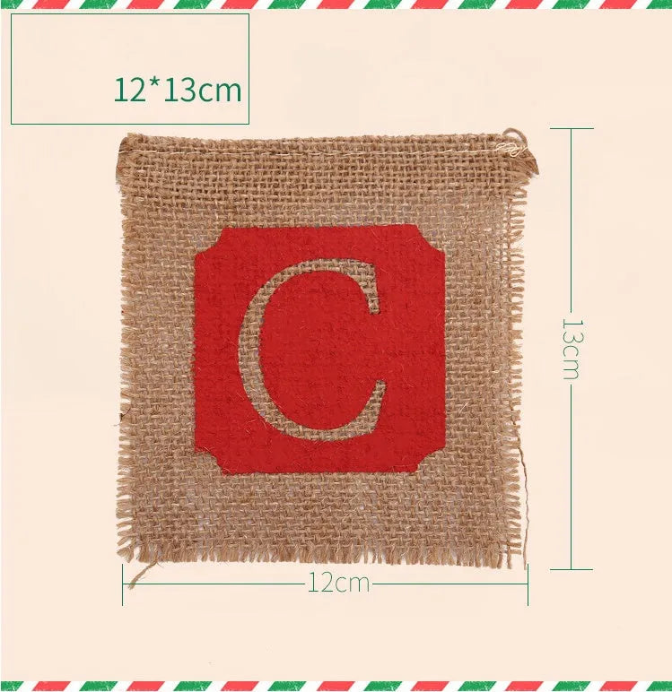 Two brown and red burlap Christmas banners with sackcloth flags hanging against a rustic backdrop.
