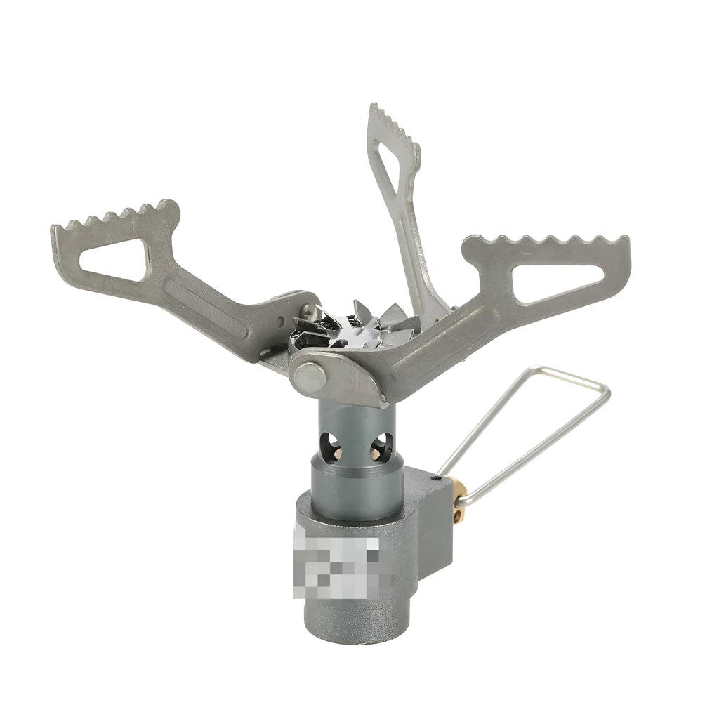 Compact one-piece propane camping stove on a rocky outdoor surface.