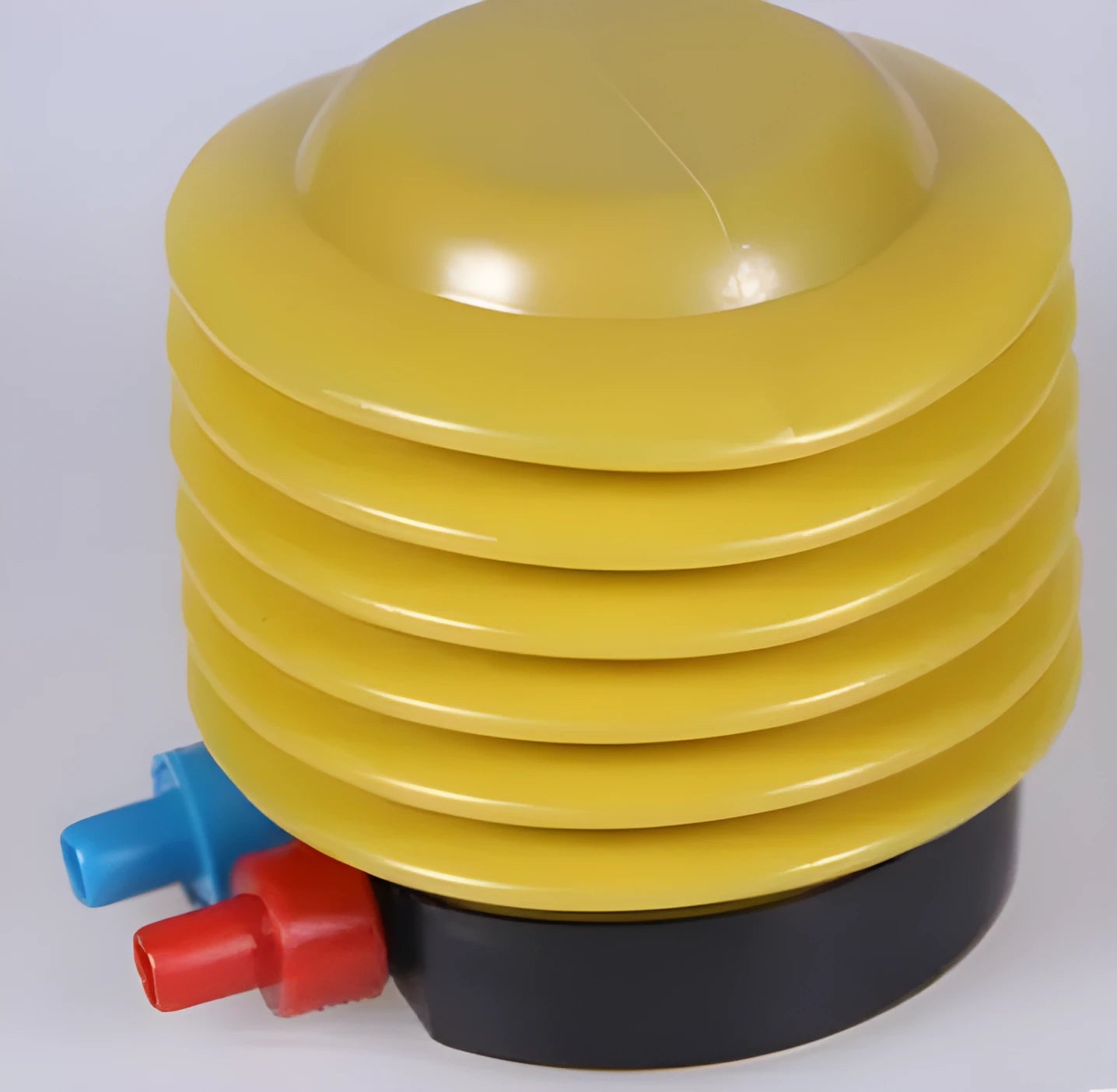 Blue and red portable plastic pedal pump for inflating swim rings, showing 4-inch diameter and valve adapters.