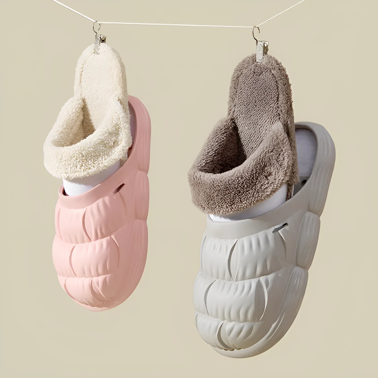 Removable fluffy slippers in beige with faux fur lining and Velcro fastening on a wooden floor