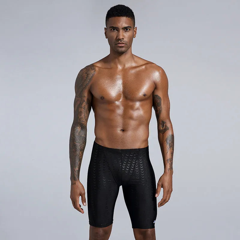 Men's solid colour swimming trunks in waterproof shark skin polyester fabric, shown in larger sizes.