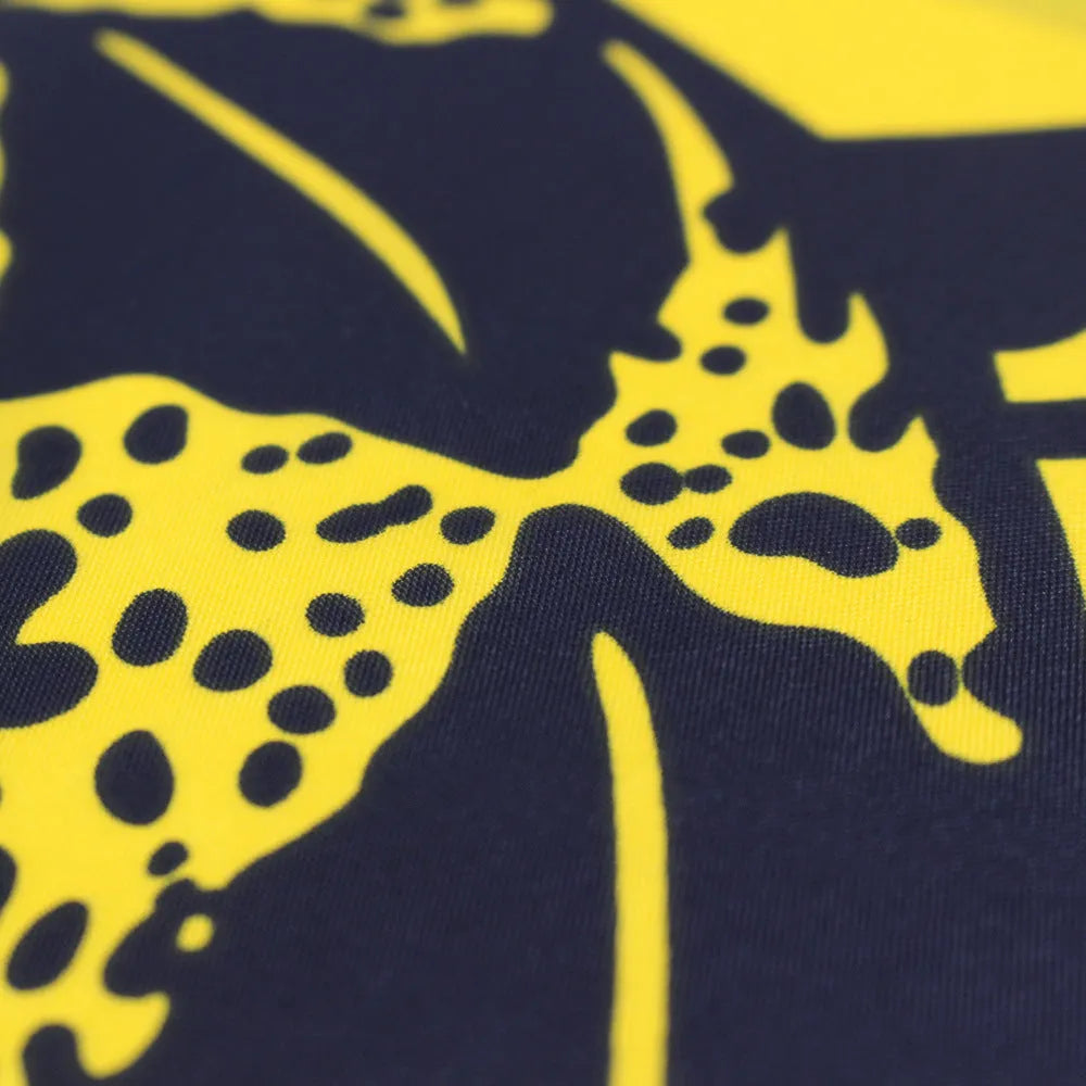Yellow polyester garden flag with screen-printed design, 90 by 150 centimetres, hanging on a fence.