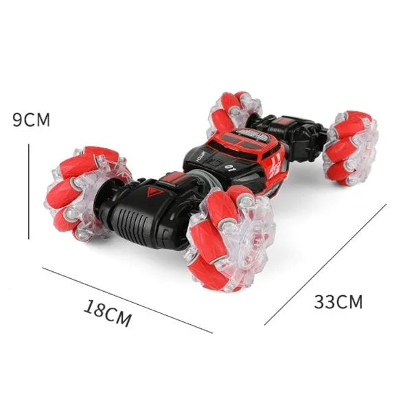 4WD RC stunt car with gesture remote control in red colour on white background showing off-road wheels and LED lights