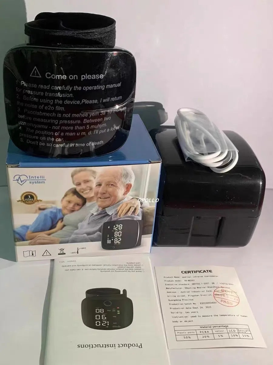 Black wrist blood pressure monitor with USB charging port on a table