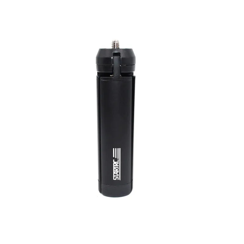 Silver aluminium alloy phone bracket for iPhone shown in clip and tripod style next to a mobile phone.