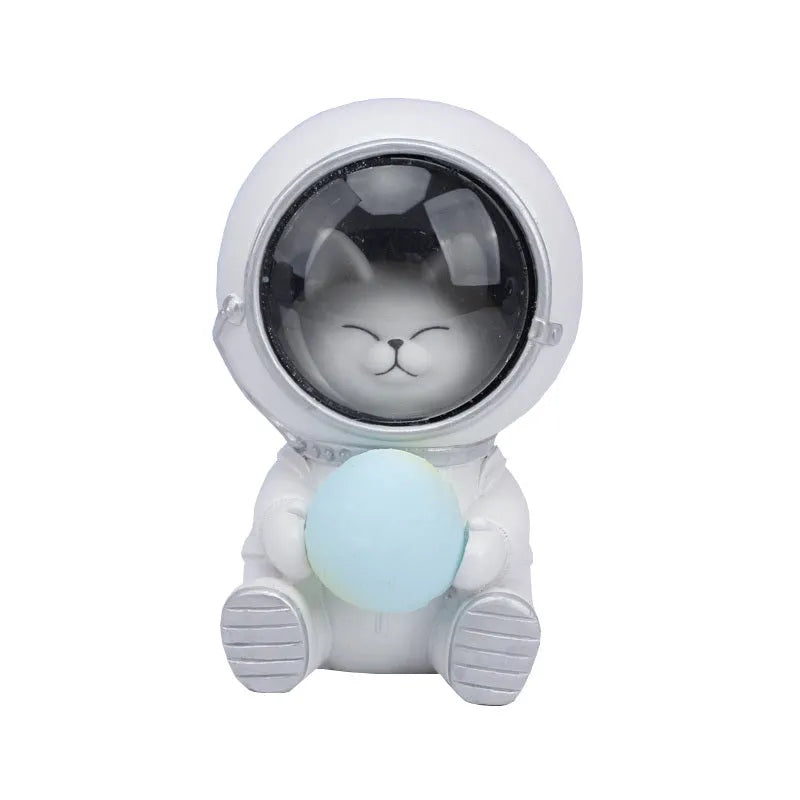 Resin bear-shaped starry sky night light with soft LED glow on a wooden table.