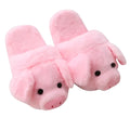 Pink adult pig-shaped floor slippers with short plush fabric on a white background.