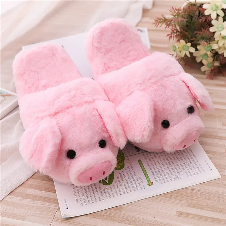 Pink adult pig-shaped floor slippers with short plush fabric on a white background.