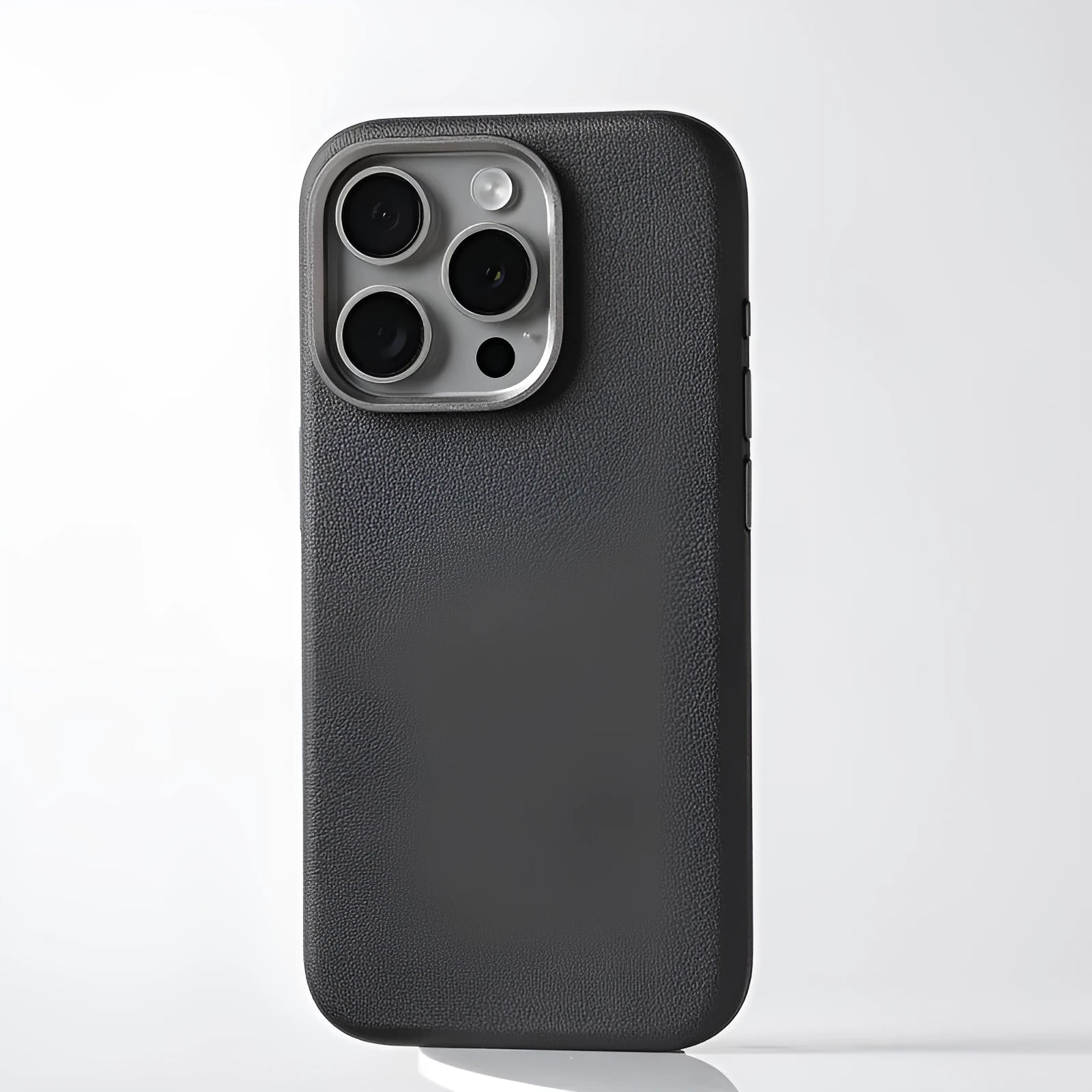 A black genuine leather iPhone case with a built-in metal alloy camera lens protector and MagSafe magnets.