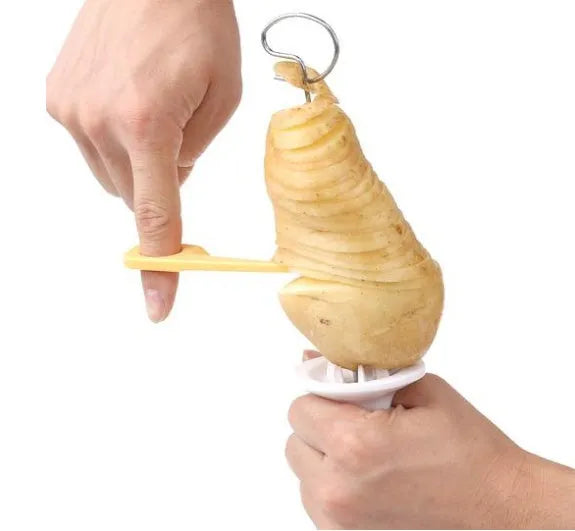 Potato cutter slicer with stainless steel blade and ABS resin handle, 11x4cm, cutting a potato into chips