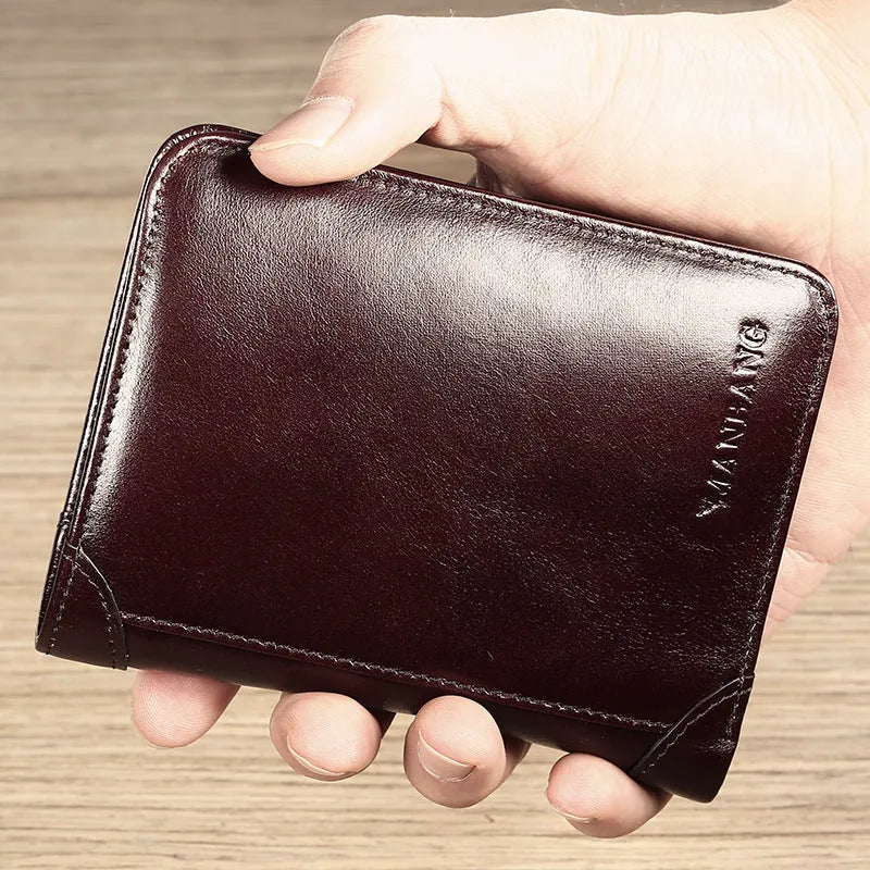 Men's black leather bifold wallet open, showing eight card slots, bill compartment, and a zip coin pocket