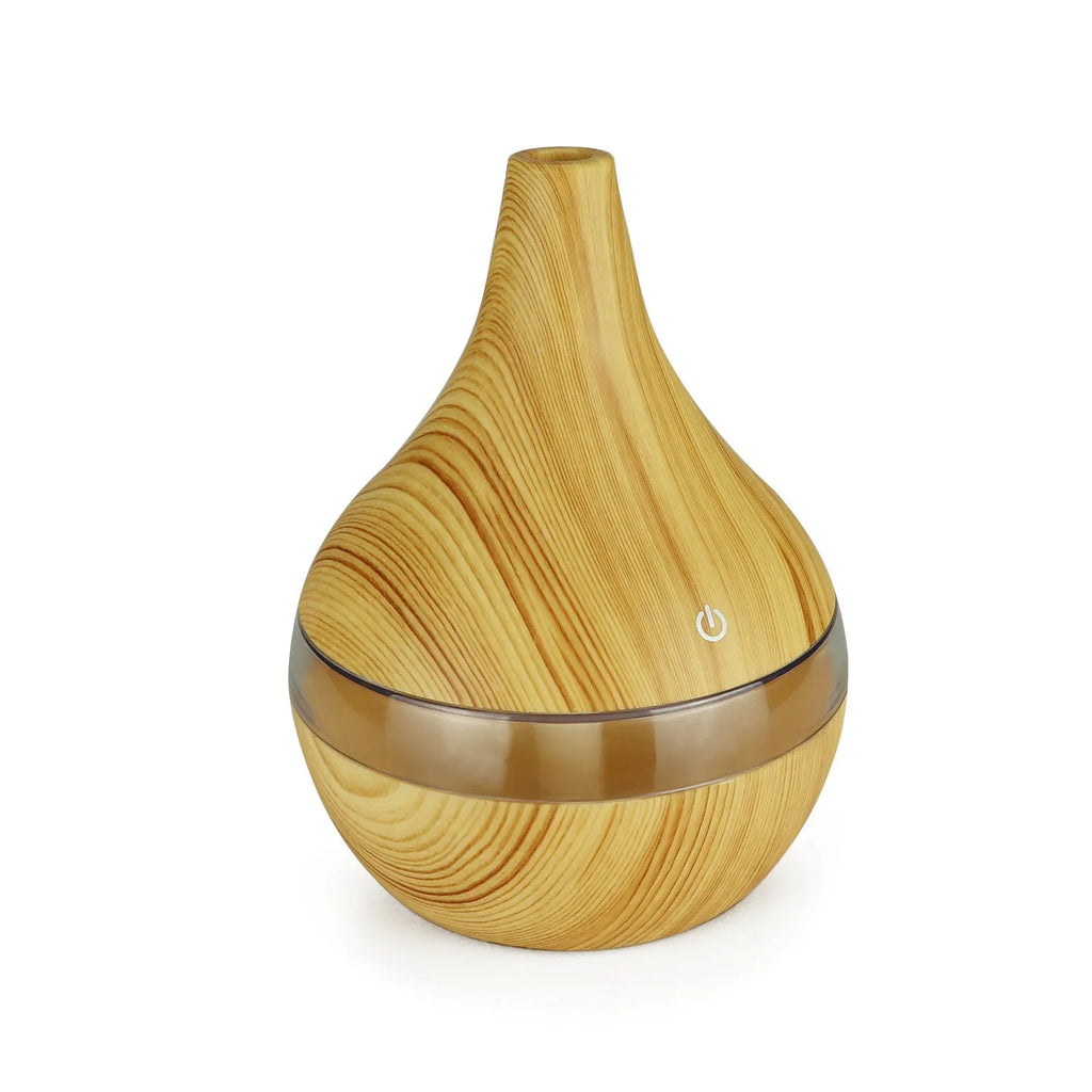 USB mini air purifier humidifier with wood grain finish in columnar shape for small rooms.
