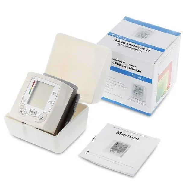 Grey wrist blood pressure monitor with ABS plastic casing showing display and cuff