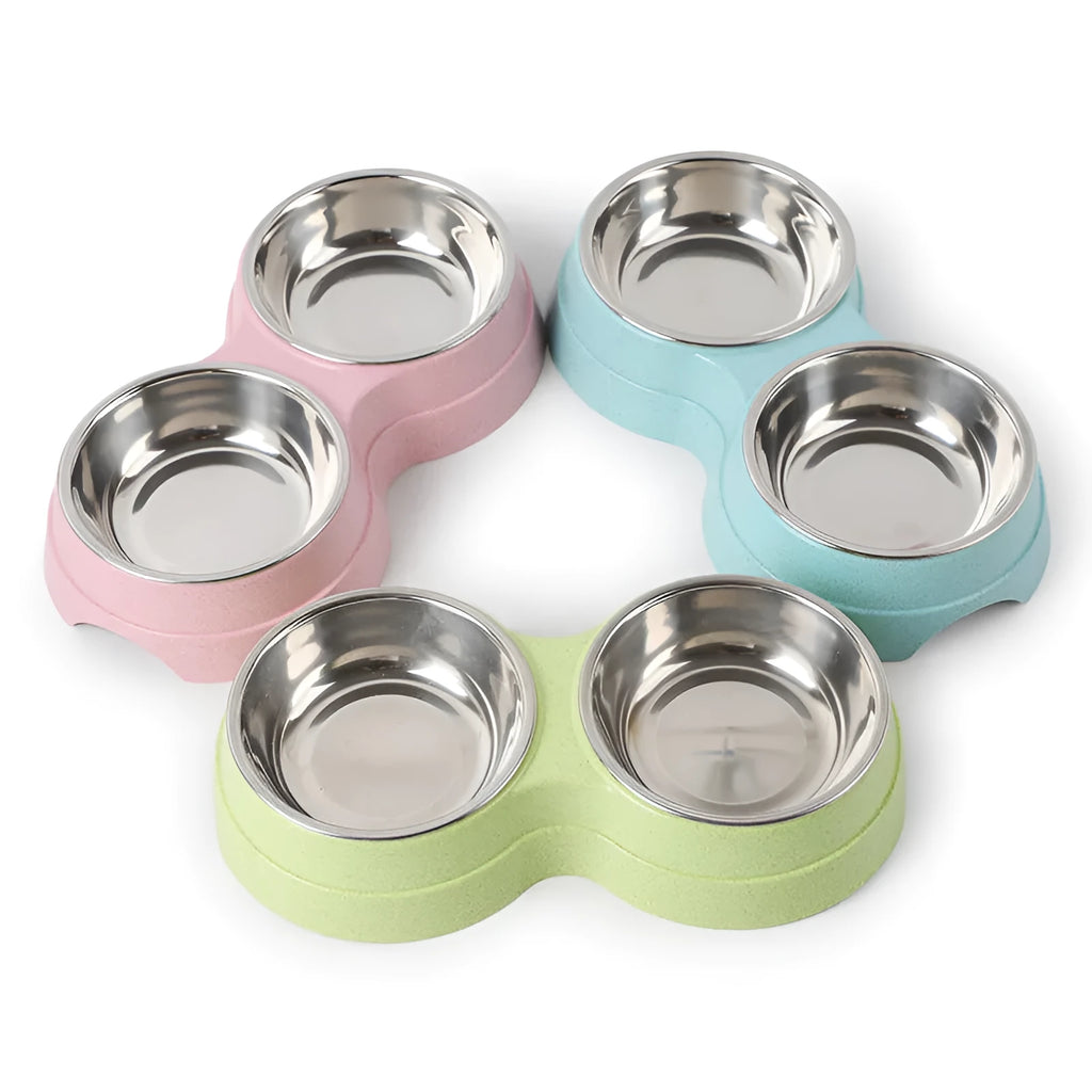 Round two-in-one dog bowl with straw in blue, green, and pink colours measuring 24.5 x 13.5 x 4.6 cm