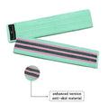 Set of three coloured fabric resistance bands and a mesh storage bag on a grey background.