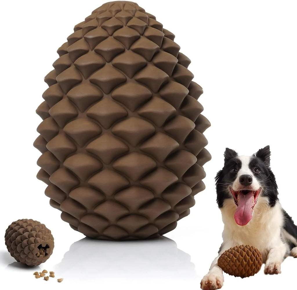 Yellow pine cone-shaped natural rubber dog chew toy with treat dispenser hole.