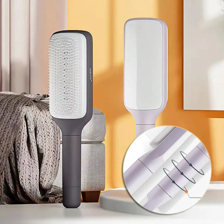 Roland purple self-cleaning hair brush with rotating telescopic handle and anti-static bristles.