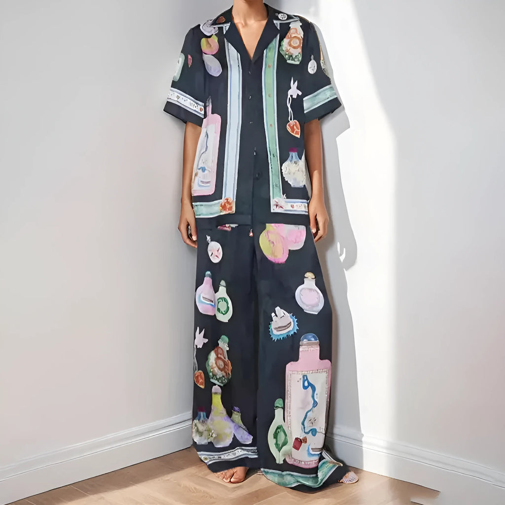 Black women's cardigan and trouser set with cartoon animation print.