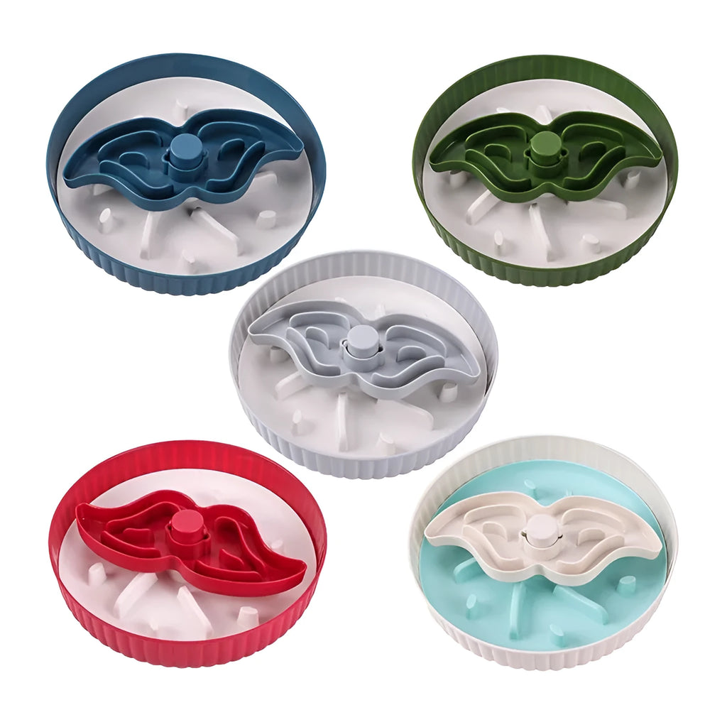 Grey interactive pet slow feeder bowl with rotating centre holding a green silicone licking mat on a kitchen floor.
