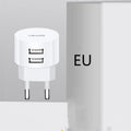 White portable universal dual USB phone charger with UK, EU, and US plugs