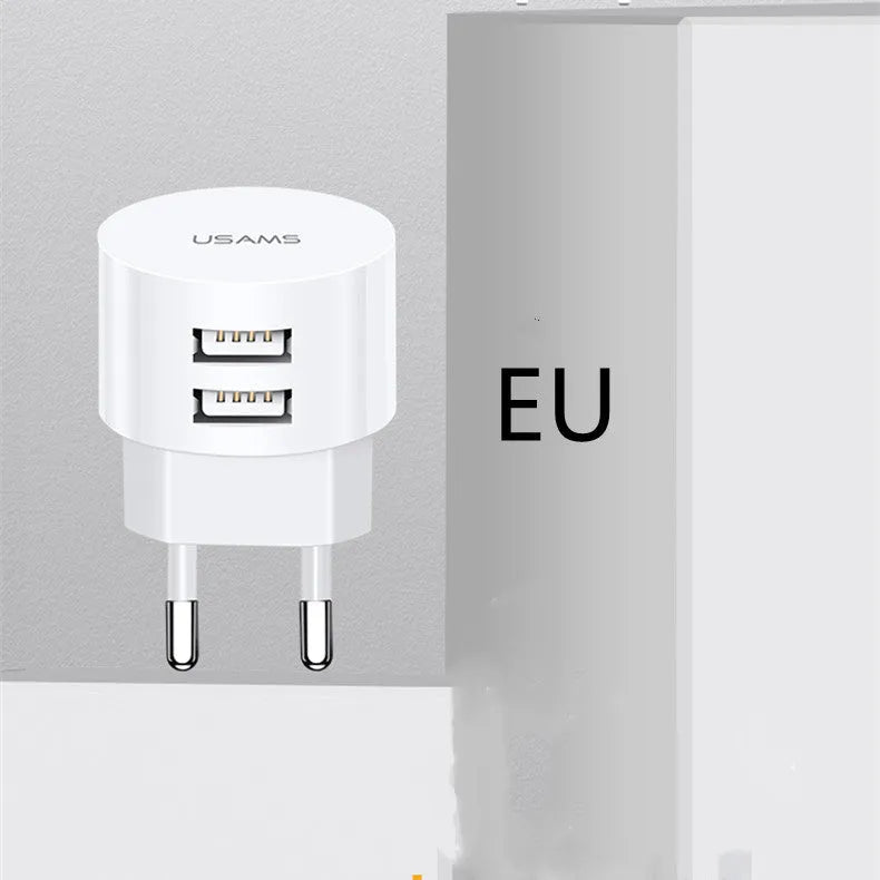 White portable universal dual USB phone charger with UK, EU, and US plugs