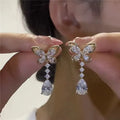 Bow shape stud earrings in platinum colour with electroplated finish on zinc alloy
