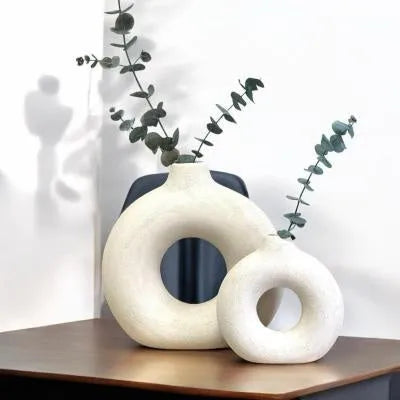 A simple modern frosted porcelain biscuit vase in a neutral colour, for flower arranging.
