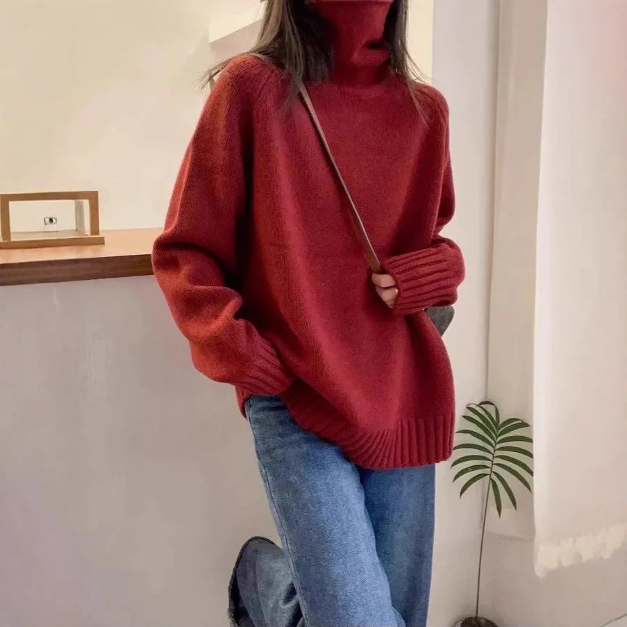 Women's loose fit black turtleneck sweater with a thick curling pile collar.