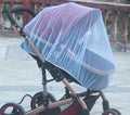 Baby stroller mosquito net full cover in black stretched over a pushchair showing elasticated edge