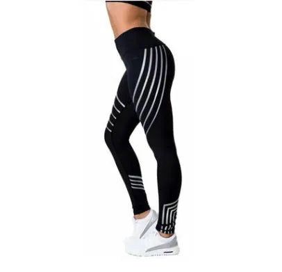 Women's black workout leggings with glowing white print pattern, showing slimming pencil pants fit.