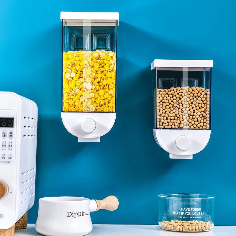 White wall-mounted transparent kitchen food storage container with easy-press cereal dispenser lid.