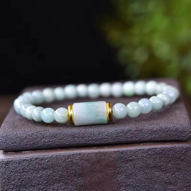 Myanmar jade bracelet with 8mm emerald colour round beads in geometric ethnic style design