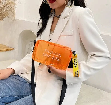 Transparent square jelly shoulder bag in PC material with an adjustable strap, shown in a light colour.