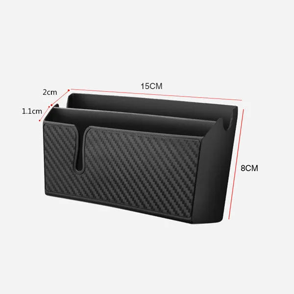 Black PVC carbon fibre pattern phone storage box with reusable adhesive on a car seat surface