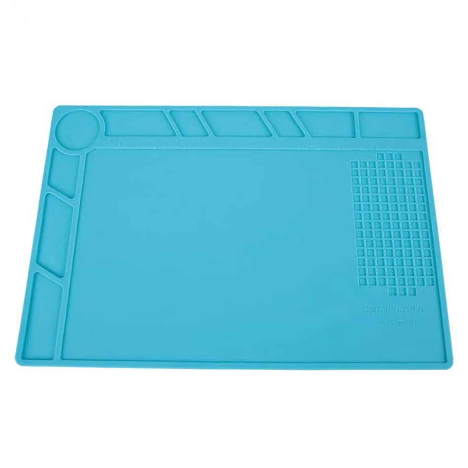Blue silicone watch repair mat with non-slip surface for component organisation during watch work