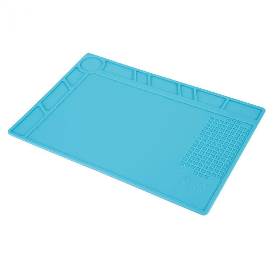 Blue silicone watch repair mat with non-slip surface for component organisation during watch work